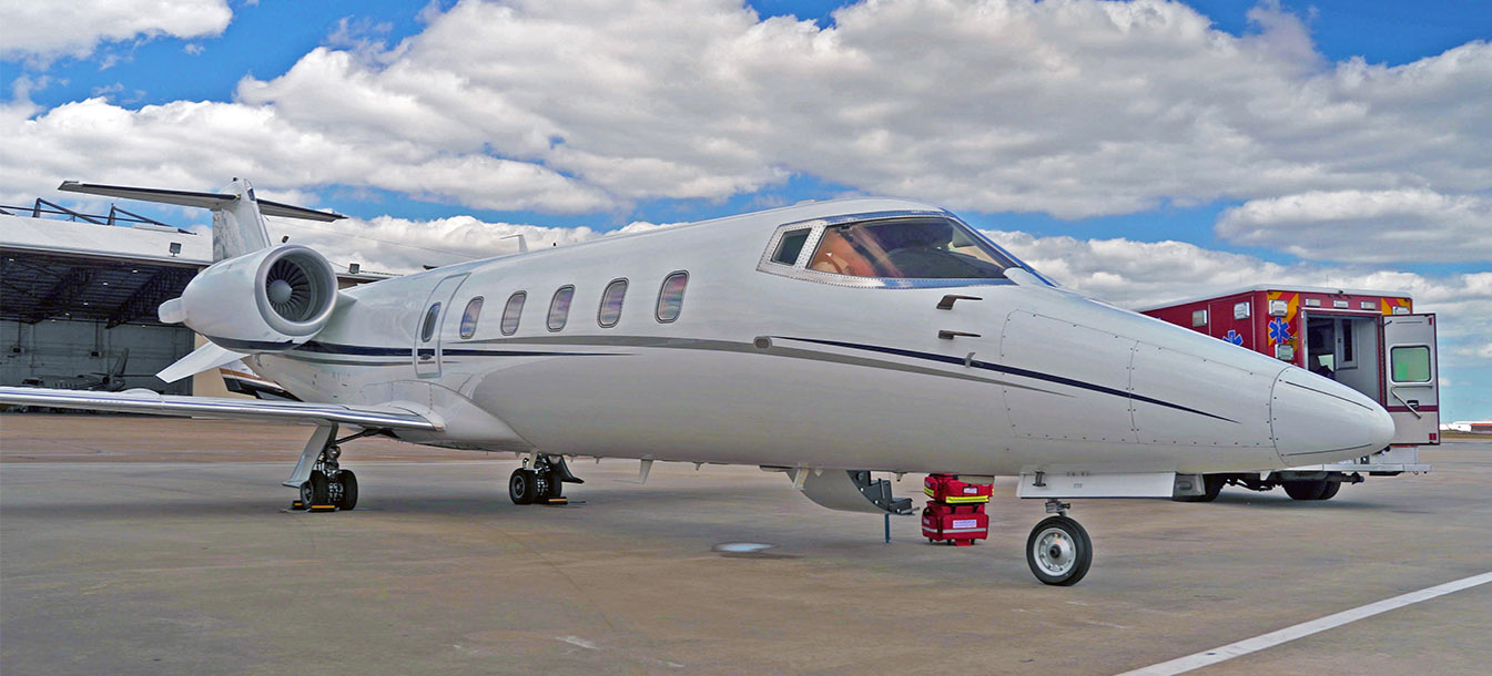Learjet 60 next to MICU Ground - Air Medical Transport h1
